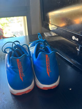 Zapatillas multitaco Adidas azules y naranjas