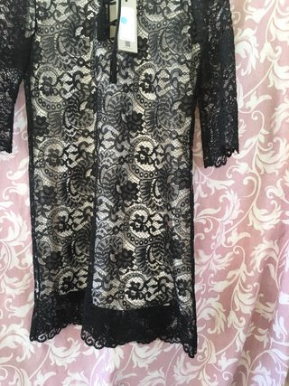 Vestito pizzo nero con scollo incrocio con nappine