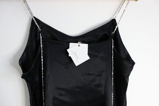 Vestito nero con spalline gioiello