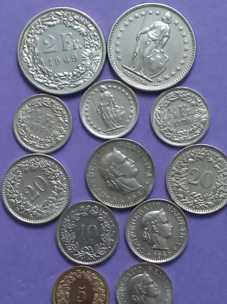 Lote de monedas suizas 12 unidades.