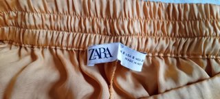 Pantalón Zara fluido raso dorado