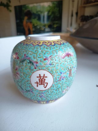 Jarrón chino celeste con flores