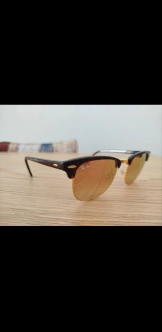 Gafas de sol Ray-Ban marrones y doradas