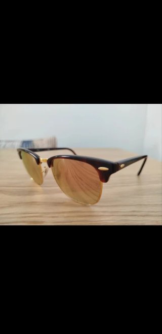 Gafas de sol Ray-Ban marrones y doradas
