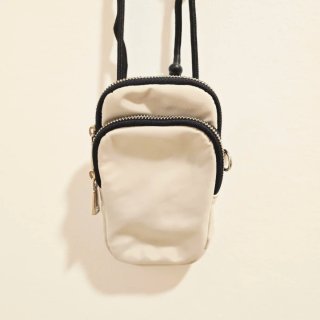Bolso Parfois portatelefono blanco y negro