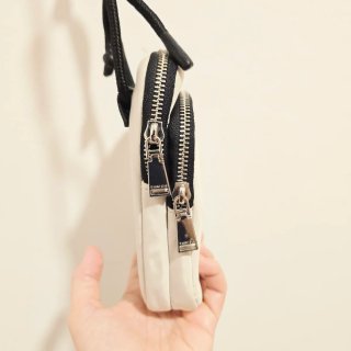 Bolso Parfois portatelefono blanco y negro
