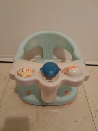 Asiento de ducha para bebé con juguetes