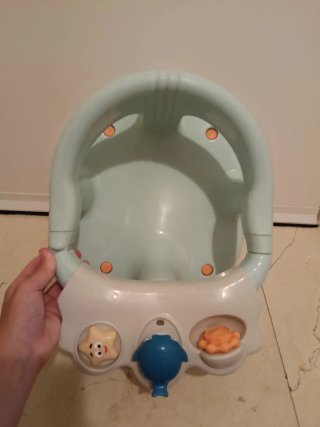 Asiento de ducha para bebé con juguetes