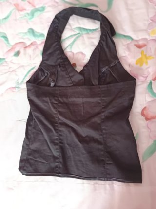 Chaleco negro tipo blazer sin mangas