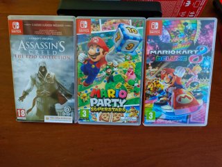 Nintendo Switch OLED + 4 Joy-Con + giochi