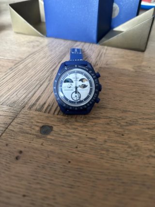 Swatch x Omega Speedmaster Snoopy