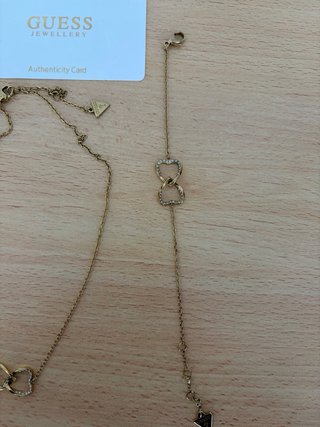 Collar y pulsera Guess dorados