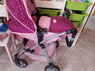 Carrito de muñecas rosa y morado