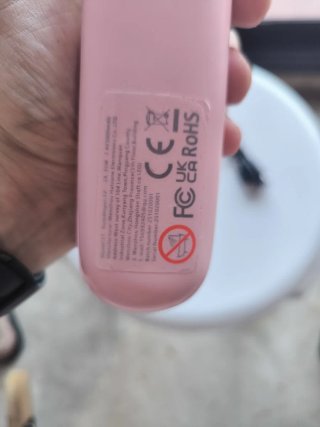 Peine alisador eléctrico rosa y negro