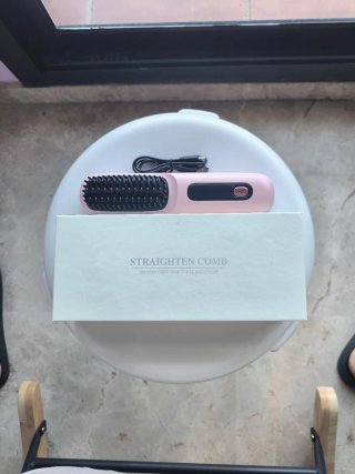 Peine alisador eléctrico rosa y negro