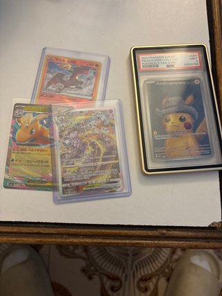 Pack de cartas Pokémon (Charizard, Pikachu, etc.)
