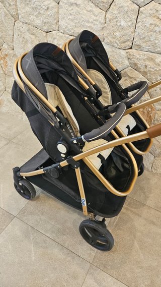 Carrito gemelar gris y dorado