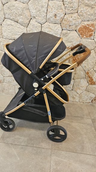 Carrito gemelar gris y dorado