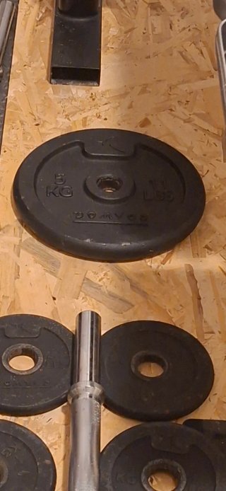 Banco de pesas y discos gimnasio