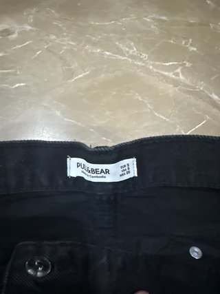 Falda vaquera negra corta cruzada
