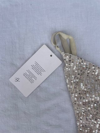 Abito lungo asimmetrico di paillettes oro