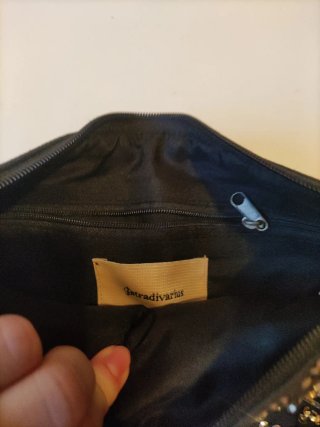 Neceser Stradivarius estrellas negro y dorado