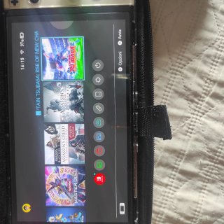 Nintendo Switch OLED + accessori e giochi