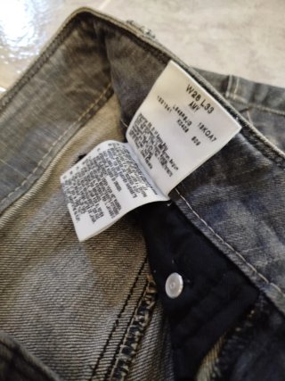 Pantalón Lee, mezcla de azul marrón.
