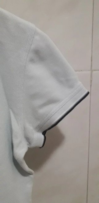 Polo Lacoste azul claro chica