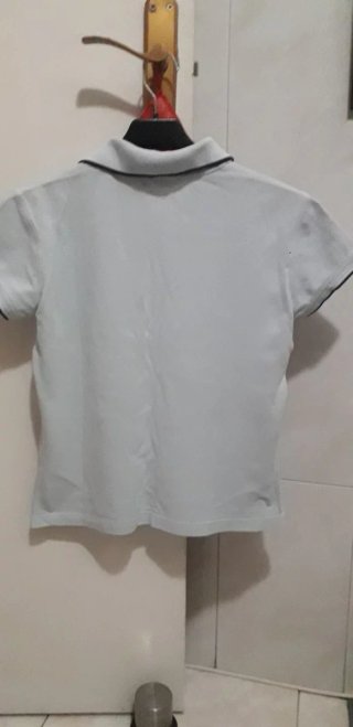 Polo Lacoste azul claro chica