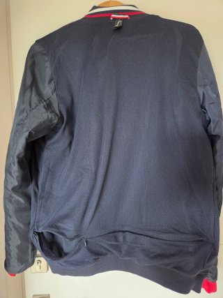 Cazadora cortavientos azul poliéster y nylon