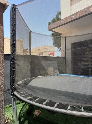 Cama elástica con red de seguridad