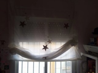 Cortinas con estrellas doradas y blancas