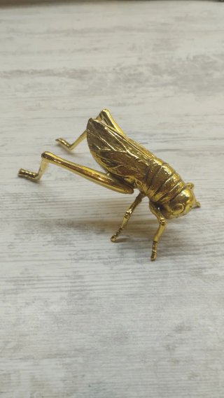 Saltamontes Zara Home metal dorado