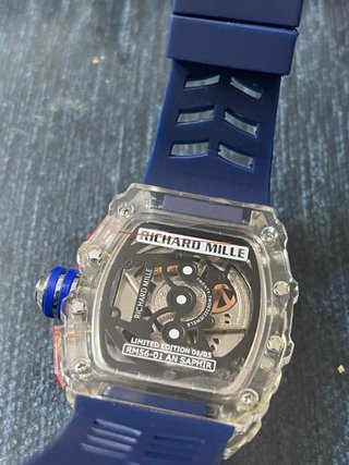 RM con correa azul y caja transparente, repararrep