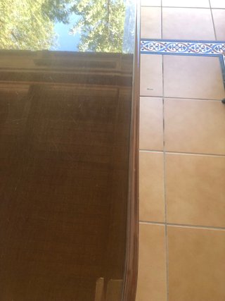 Mesa de comedor ovalada con tapa de cristal