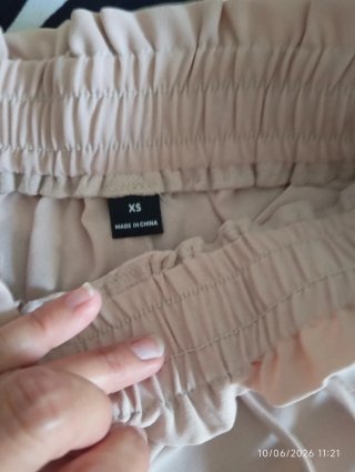 Pantalones anchos plisados