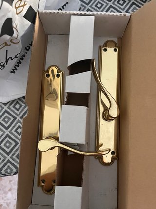 Manivelas doradas para puerta