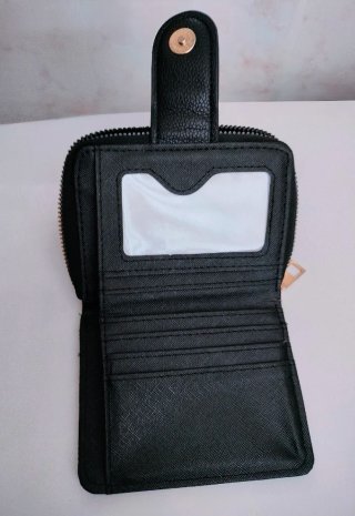 Monedero negro acolchado