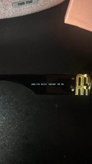 Occhiali da sole Miu Miu SMU11W