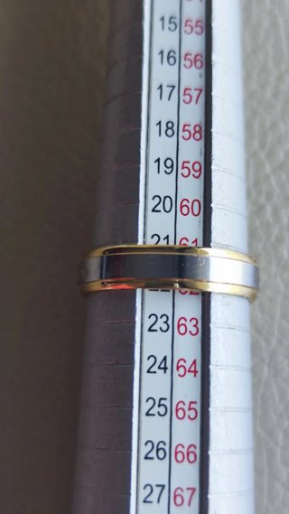 Anillo chapado oro y plata nuevo.