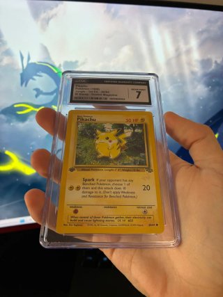 Pikachu W Stamp CGC 7 Jungle 1st Ed.