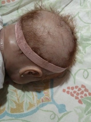 Muñeca Reborn Bebé con Chupete Hello Kitty