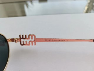 Occhiali da sole Miu Miu oro e neri