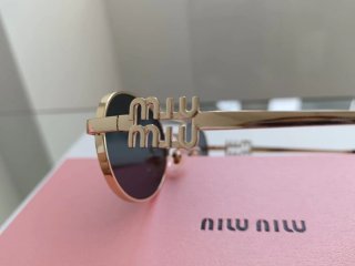 Occhiali da sole Miu Miu oro e neri