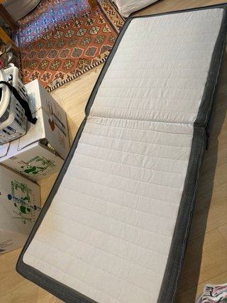 Sillón cama gris de tela