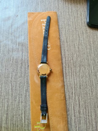 Reloj Cartier vintage con caja dorada y esfera bla