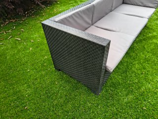 Sofa de exterior con reposapies y cojines de tela