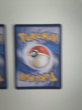 2 Cartas Pokémon Charizard VASTRO y Pikachu VMAX