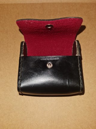 Estuche de piel negro para lentes de fotografía